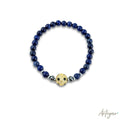 Elegant Lapis Lazuli Stretch Bracelet with a Golden Crystal-Inlaid Soccer Ball Charm, Miami Soccer Design by Arteyar, Sophisticated Sporty Jewelry for Soccer Fans.