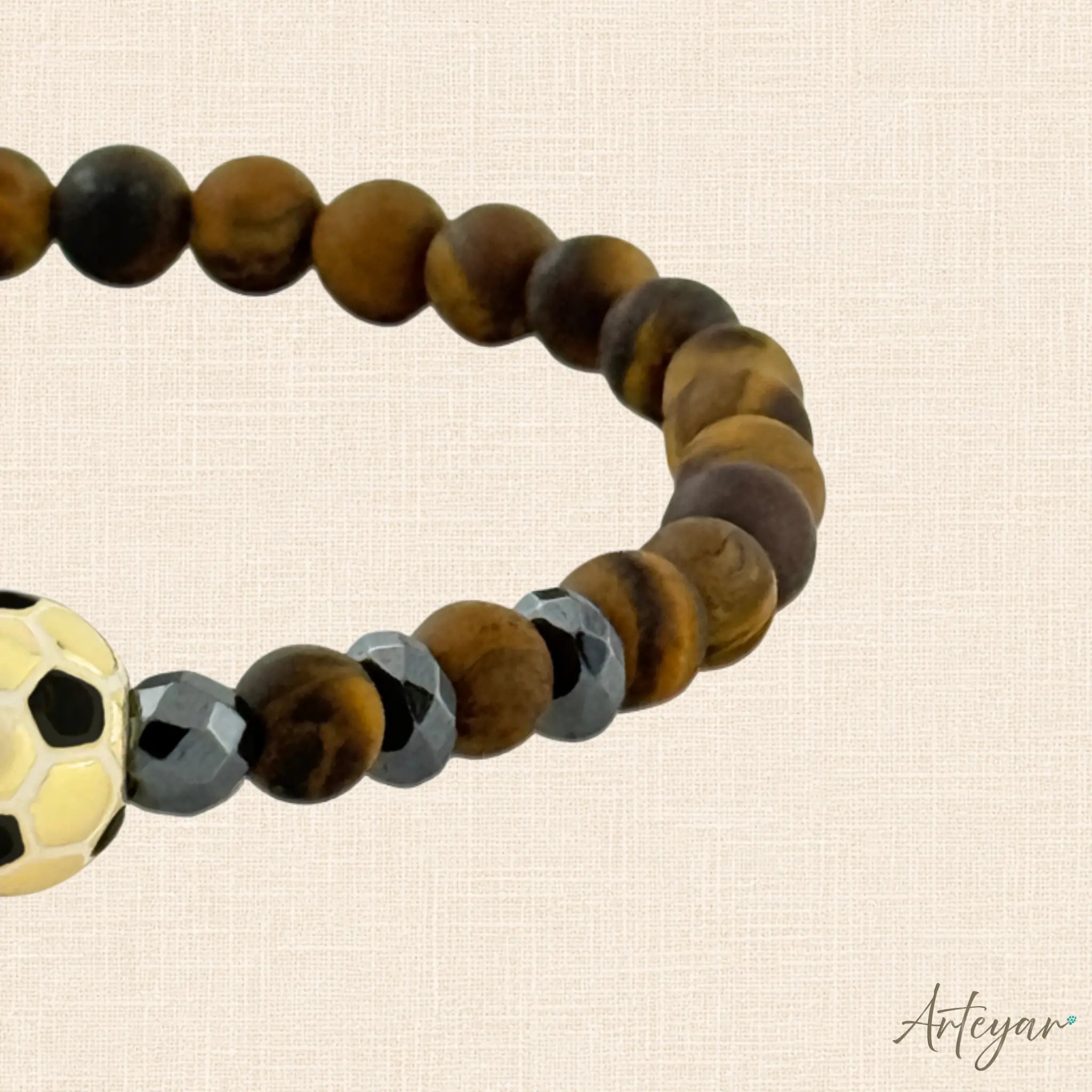 Matte Tiger's Eye Bracelet with a Golden Soccer Ball Charm and Hematite Accents, Sedona Soccer Design by Arteyar, Combines Natural Stone Elegance with Sporty Flair.