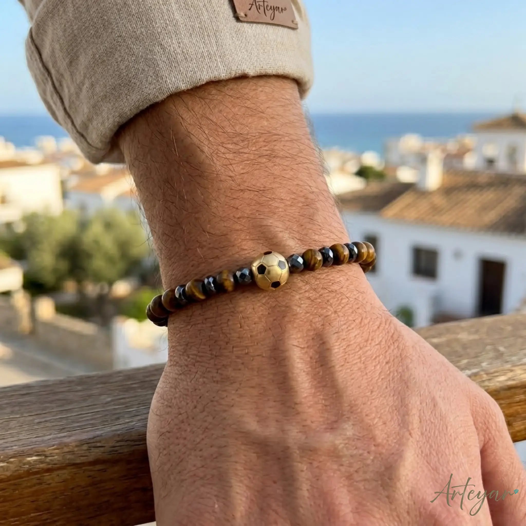 Matte Tiger's Eye Bracelet with a Golden Soccer Ball Charm and Hematite Accents, Sedona Soccer Design by Arteyar, Combines Natural Stone Elegance with Sporty Flair.
