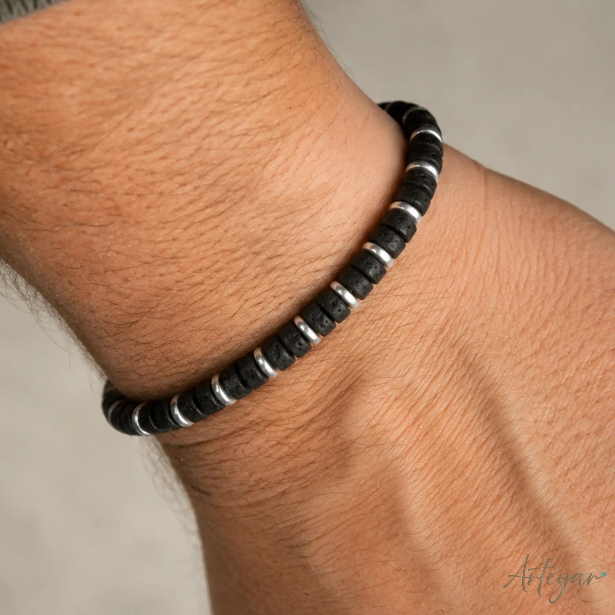 Unisex Volcanic Stone and Hematite Bracelet with Black Beads, Nero Design by Arteyar, Minimalist Modern Jewelry with Adjustable Cord, Elegant and Strong Accessory.