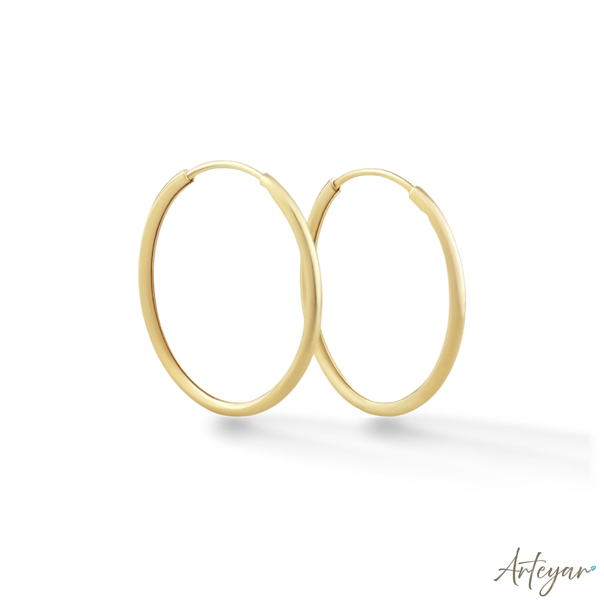 Golden Hoop Earrings for Women, Serene Design by Arteyar, Classic Elegant Round Jewelry for All Occasions.