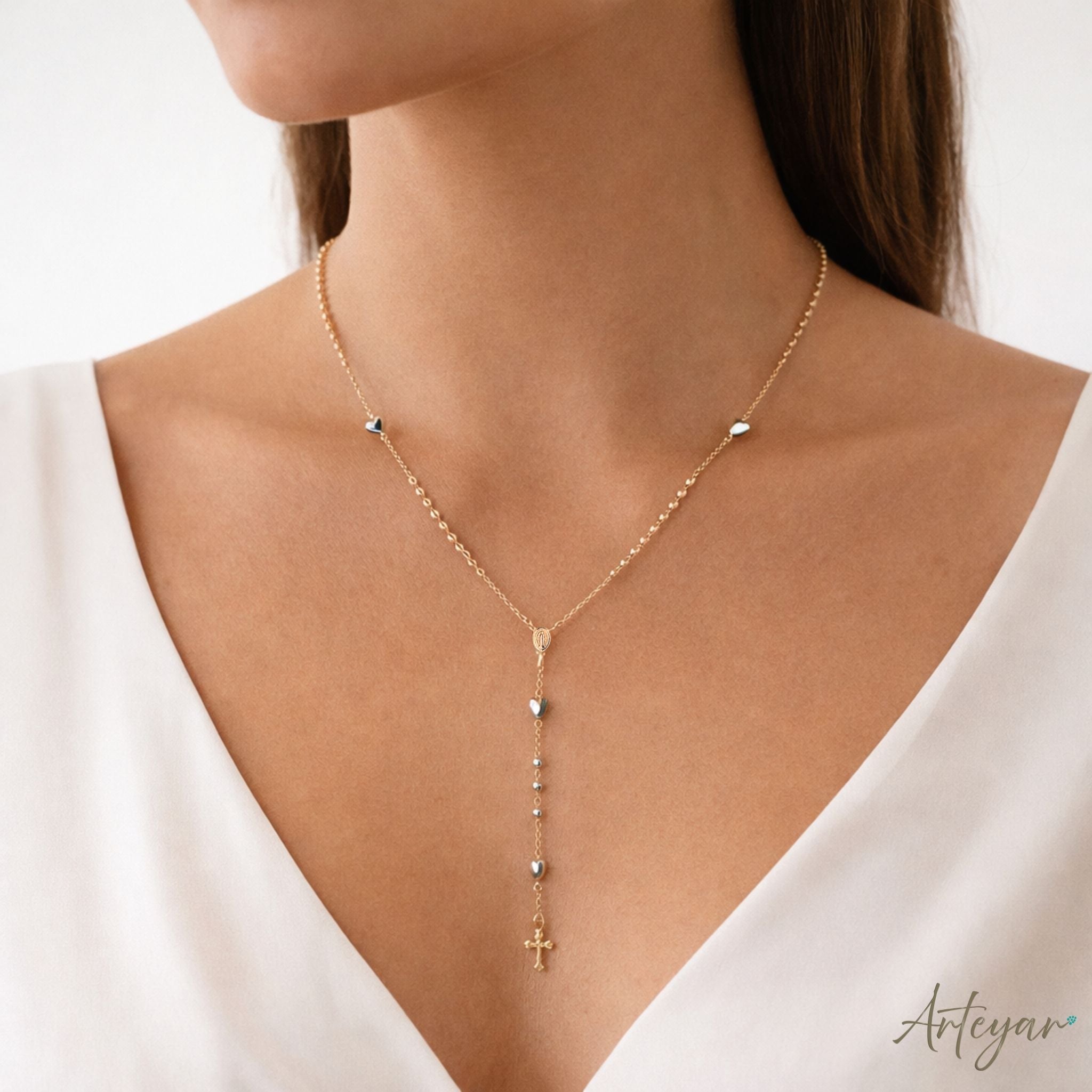 Golden Rosary with Heart-Shaped Hematite Beads, Gold Medal, and Cross, Rosary Design by Arteyar, Versatile for Prayer or as a Sophisticated Accessory.