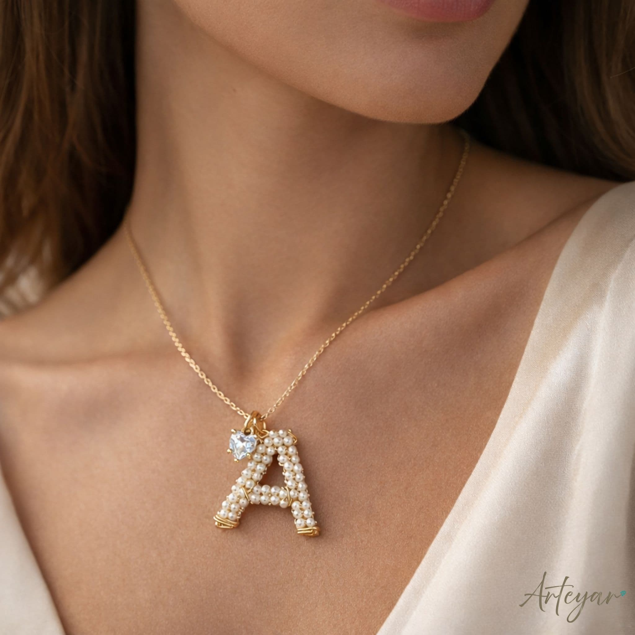 Elegant Golden Necklace with a Personalized Hand-Crafted Pearl Initial and Sparkling Heart Charm, Signa Design by Arteyar, Classic Elegance with Personal Sentiment, Perfect for Daily Wear or as a Meaningful Gift.