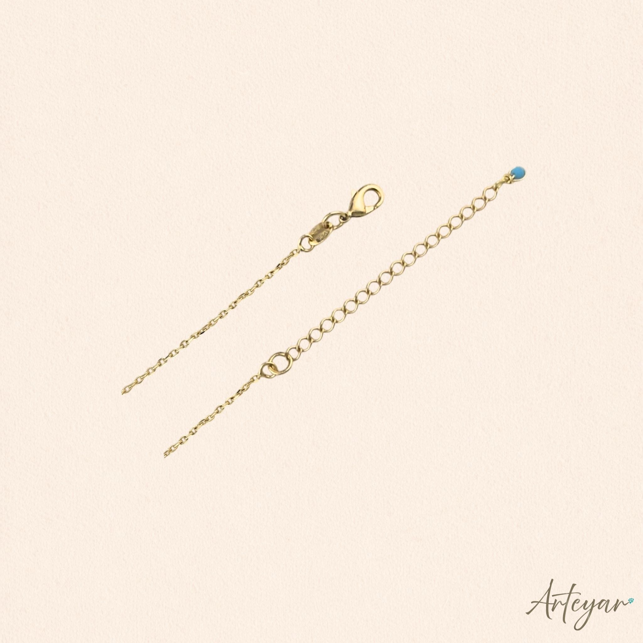 Delicate gold necklace with child-shaped pendant and crystals – Petit by Arteyar