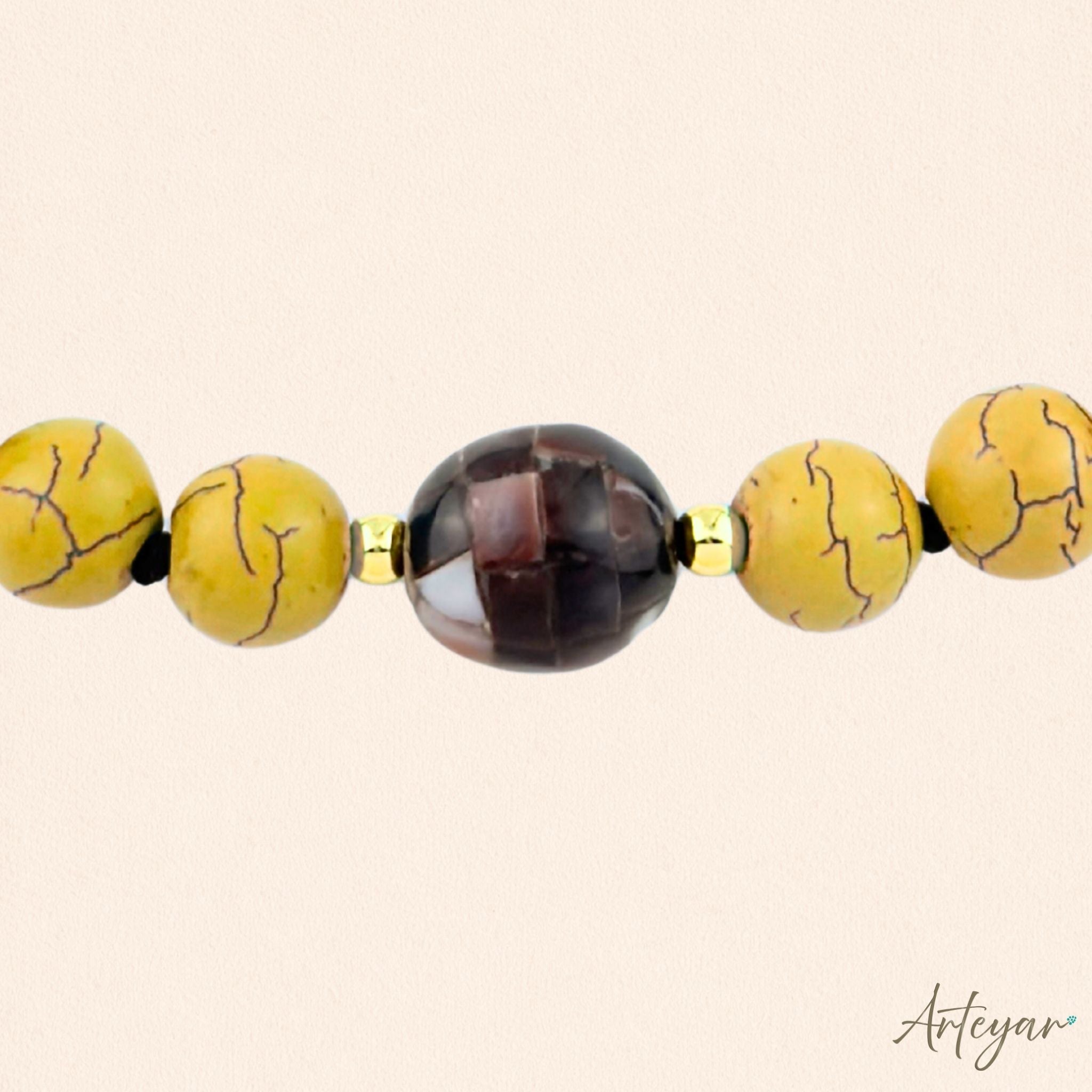 Elegant Hand-Knotted Necklace with Vibrant Yellow Howlite Beads and a Pearlescent Centerpiece, Gaia Yellow Design by Arteyar, Modern Jewelry that Adds Sophisticated Color.