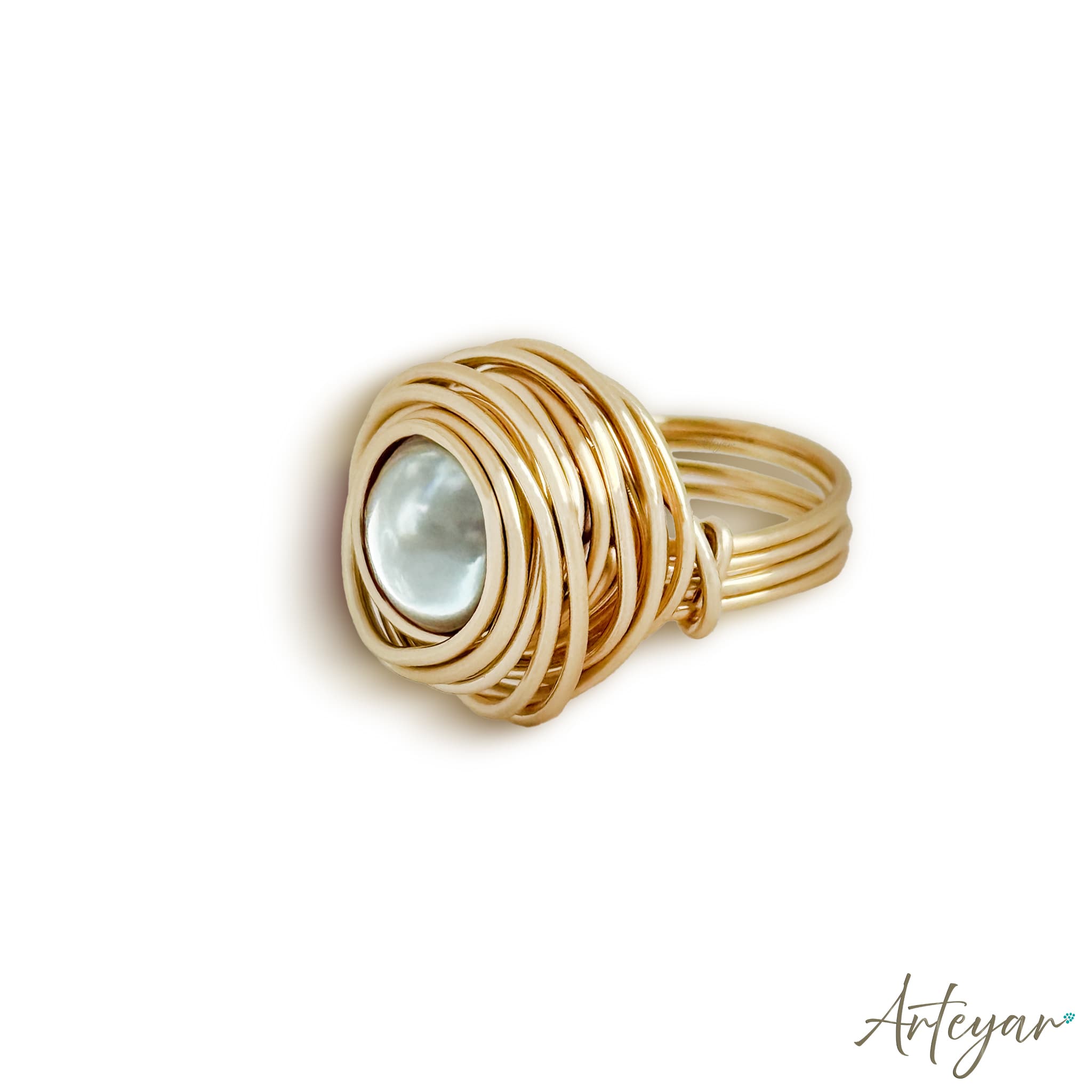 Elegant Ring with a Lustrous Pearl Centerpiece Encircled by Gold Wire Spirals, Nido Pearl Ring Design by Arteyar, Minimalist and Striking Statement Jewelry.